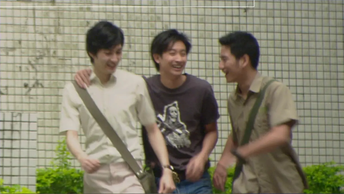 Three friends sharing a moment in the film